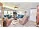 Living room with teal sofas and a ceiling fan at 5002 Lodgewood Dr, Lakeland, FL 33810