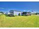 Home's exterior with well-maintained lawn and flag at 5002 Lodgewood Dr, Lakeland, FL 33810