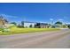 Single-wide manufactured home with screened porch and spacious yard at 5002 Lodgewood Dr, Lakeland, FL 33810
