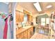Bright kitchen features wood cabinets and a view into dining area at 5002 Lodgewood Dr, Lakeland, FL 33810