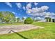 Community basketball court with surrounding green space at 5002 Lodgewood Dr, Lakeland, FL 33810