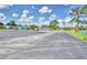 Spacious community parking lot with lake views at 5002 Lodgewood Dr, Lakeland, FL 33810