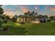 Home features a screened porch and spacious backyard at 1175 E George St, Bartow, FL 33830