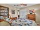 Spacious bedroom with wooden dresser and built-in shelves at 1175 E George St, Bartow, FL 33830