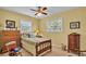 Charming bedroom with wood furniture and large windows at 1175 E George St, Bartow, FL 33830