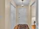 Bright entryway with hardwood floors, double closets, and a view of the living area at 1175 E George St, Bartow, FL 33830