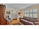 Living area featuring hardwood floors, a comfortable sofa, and a view of the entryway at 1175 E George St, Bartow, FL 33830