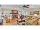 Living room features a brick fireplace and hardwood floors at 1175 E George St, Bartow, FL 33830