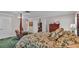Main bedroom with a four-poster bed and ensuite access at 1175 E George St, Bartow, FL 33830