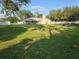 Large backyard with grassy area and partial view of home at 4009 Carey Ct, Auburndale, FL 33823