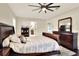 Bright bedroom with a king-size bed and ensuite bathroom at 4009 Carey Ct, Auburndale, FL 33823