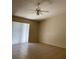 Living room with tile floors and ceiling fan at 5009 Cimarron Dr, Lakeland, FL 33813