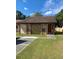Single story house with stone accents and a brown roof at 5009 Cimarron Dr, Lakeland, FL 33813