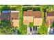 Aerial view of three houses with brown roofs and green lawns at 5009 Cimarron Dr, Lakeland, FL 33813