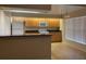 Kitchen boasts ample wood cabinets and modern appliances at 5009 Cimarron Dr, Lakeland, FL 33813