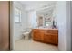 Clean bathroom with a toilet, sink vanity, and hexagonal tile floor at 941 Devonshire Way, Lake Wales, FL 33853