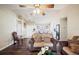 Living room with hardwood floors, neutral decor, and view to dining area at 941 Devonshire Way, Lake Wales, FL 33853