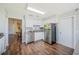 Kitchen features stainless steel appliances, granite countertops and white cabinets at 941 Devonshire Way, Lake Wales, FL 33853