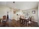 Bright dining room features a wood table and chairs, hardwood floors, and access to other rooms at 941 Devonshire Way, Lake Wales, FL 33853