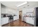 Modern kitchen with stainless steel appliances and granite countertops at 941 Devonshire Way, Lake Wales, FL 33853