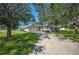 House with driveway and mature trees at 941 Devonshire Way, Lake Wales, FL 33853
