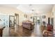 Spacious living room with hardwood floors and sliding doors leading to a screened patio at 941 Devonshire Way, Lake Wales, FL 33853