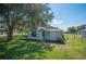 House back with large tree and shed at 941 Devonshire Way, Lake Wales, FL 33853