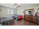 Charming bedroom with a twin bed, dresser, and ceiling fan at 941 Devonshire Way, Lake Wales, FL 33853