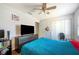 Spacious bedroom with a double bed, large TV, and plenty of storage at 941 Devonshire Way, Lake Wales, FL 33853