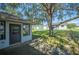 Large backyard with mature tree and patio at 941 Devonshire Way, Lake Wales, FL 33853