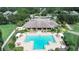 Community pool and clubhouse with surrounding homes at 2356 Lake James Way, Lakeland, FL 33810