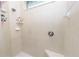 Clean shower with built-in seat and tiled walls at 2356 Lake James Way, Lakeland, FL 33810