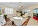 Relaxing living room with hardwood floors, comfy seating, and a built-in entertainment center at 2356 Lake James Way, Lakeland, FL 33810