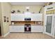 White kitchen with stainless steel appliances and ample counter space at 2356 Lake James Way, Lakeland, FL 33810