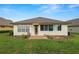 Well-maintained home with a brick patio and lush lawn at 2356 Lake James Way, Lakeland, FL 33810