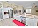 Bright kitchen with white cabinets and stainless steel appliances at 2356 Lake James Way, Lakeland, FL 33810