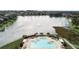 Community pool and lakefront property with homes at 2356 Lake James Way, Lakeland, FL 33810