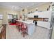 Open concept kitchen with island and stainless steel appliances at 2356 Lake James Way, Lakeland, FL 33810