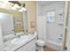 Clean bathroom with a tub, shower, and granite countertop at 2356 Lake James Way, Lakeland, FL 33810
