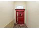 Inviting entryway with a red door and welcoming mat at 2356 Lake James Way, Lakeland, FL 33810
