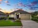 One-story home with a two-car garage and landscaped yard at 2356 Lake James Way, Lakeland, FL 33810