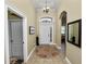 Bright foyer featuring a circular rug and mirror at 2356 Lake James Way, Lakeland, FL 33810