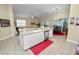 Large kitchen with an island and a view into the Gathering room at 2356 Lake James Way, Lakeland, FL 33810