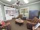 Clubhouse library with built-in bookshelves and seating at 2356 Lake James Way, Lakeland, FL 33810