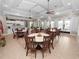 Community room features tables, chairs, and a kitchenette at 2356 Lake James Way, Lakeland, FL 33810