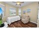 Bright bedroom with a cozy armchair and large window at 2356 Lake James Way, Lakeland, FL 33810