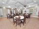 Community room with multiple tables and chairs, suitable for gatherings at 2356 Lake James Way, Lakeland, FL 33810
