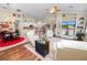 Open concept kitchen and living area with hardwood floors and island at 2356 Lake James Way, Lakeland, FL 33810