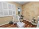Relaxing sitting area with wicker furniture and hardwood floors at 2356 Lake James Way, Lakeland, FL 33810