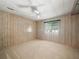 Spacious bedroom with wall-to-wall carpeting and ceiling fan at 134 Lake Hazel Dr, Winter Haven, FL 33884